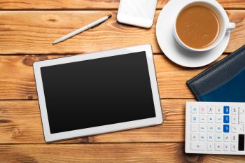 digital-tablet-and-coffee-cup-on-wooden-table-2025-02-25-00-34-48-utc350
