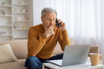 mature-man-in-conversation-holding-phone-to-ear-2025-03-18-17-15-12-utc 350