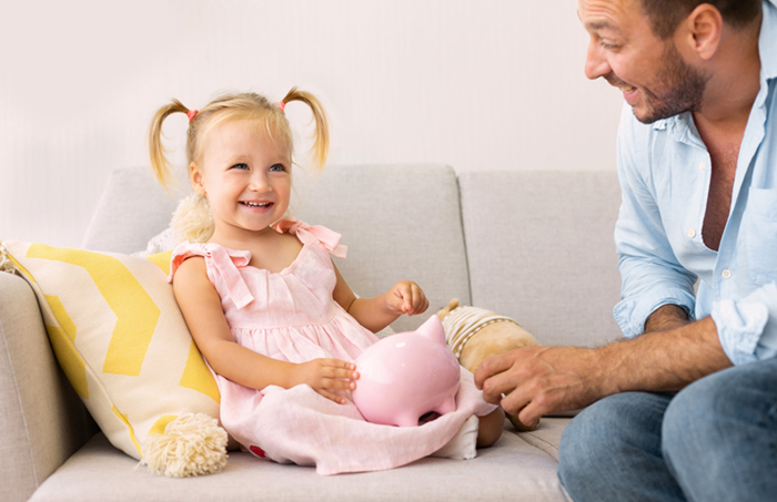 tad teaching his child how to save money