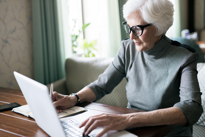 senior woman planning at table